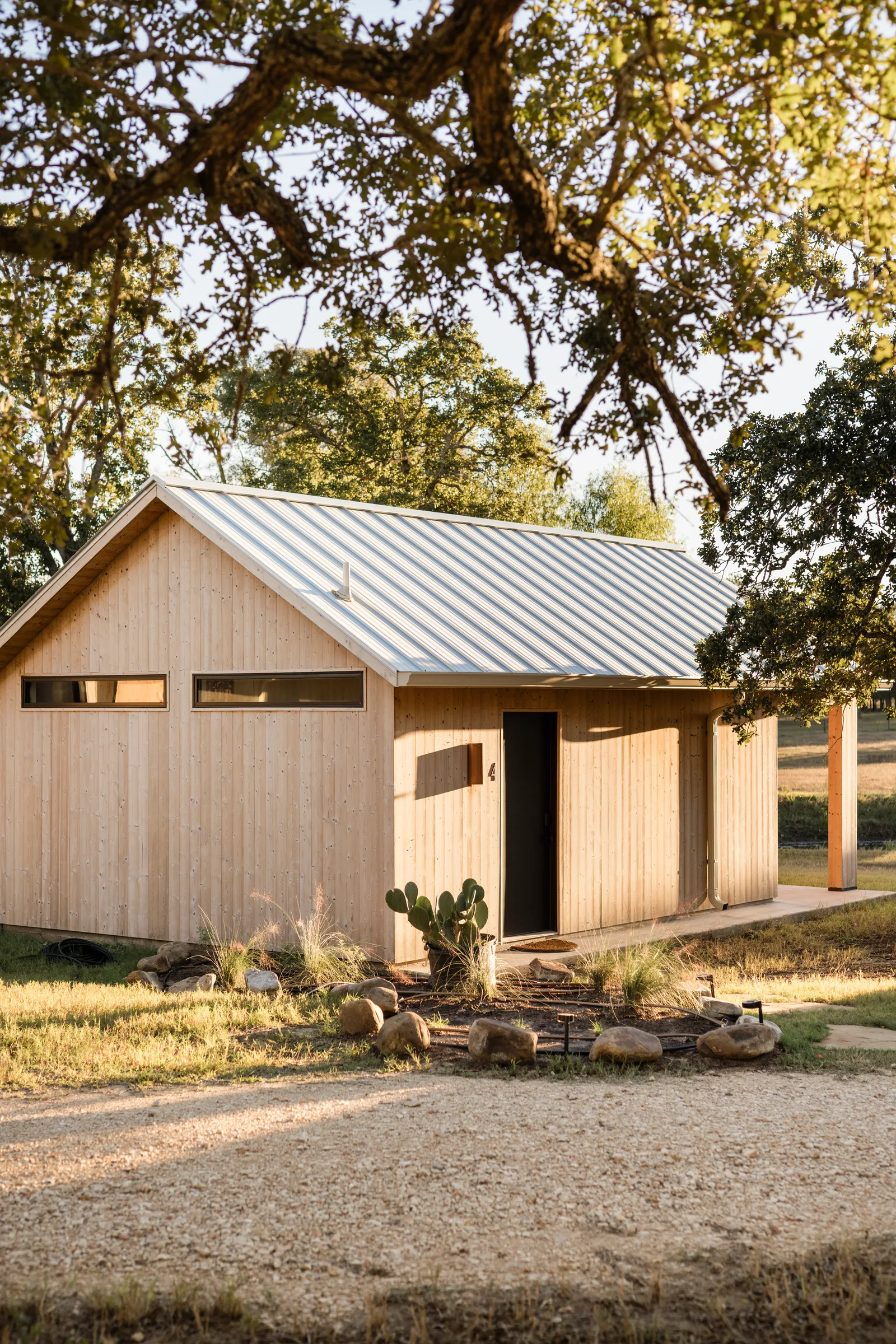 Serana cabin four exterior beneath oak branches